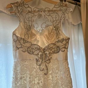 Beautiful detailed used once wedding dress